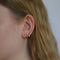 Twist earring with gemstone