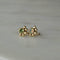 Twist earring with round stone and gold details